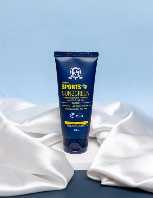 a tube of sunscreen sitting on top of a white cloth